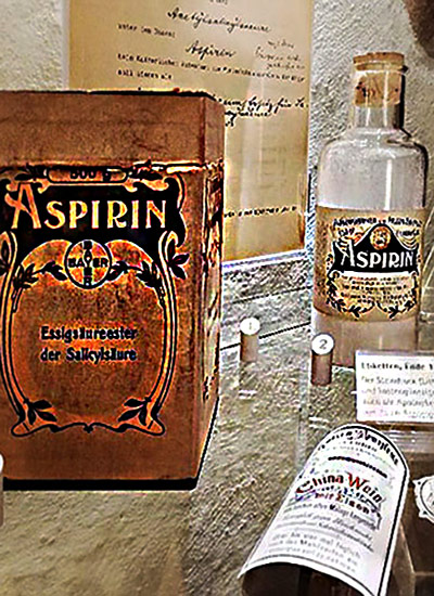 A showcase with early boxes and bottles of Aspirin